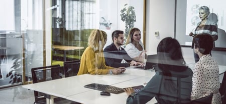 diverse business people seated around a conference table